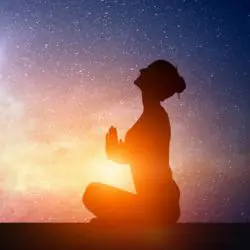 image of the soul energy surrounding a woman who is concentrating on manifestation