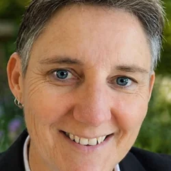 Angel psychic reader and psychic medium portrait, friendly professional headshot with natural background