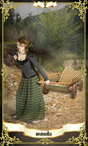 10 of wands tarot card showing a woman in country clothing pulling a farm cart