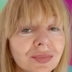 Portrait of Fay, an experienced clairvoyant psychic medium offering intuitive and compassionate psychic readings.