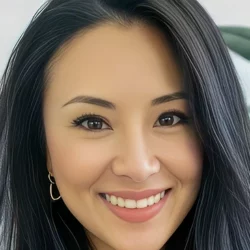 Serena psychic reader close-up portrait with long dark hair and warm smile
